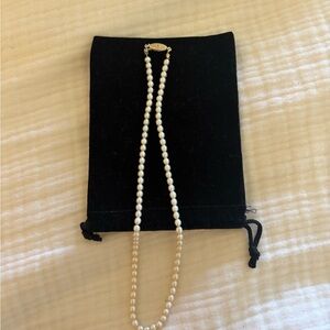 Elegant Real Pearl Necklace.  Small cultured pearls with gold clasp -not marked.